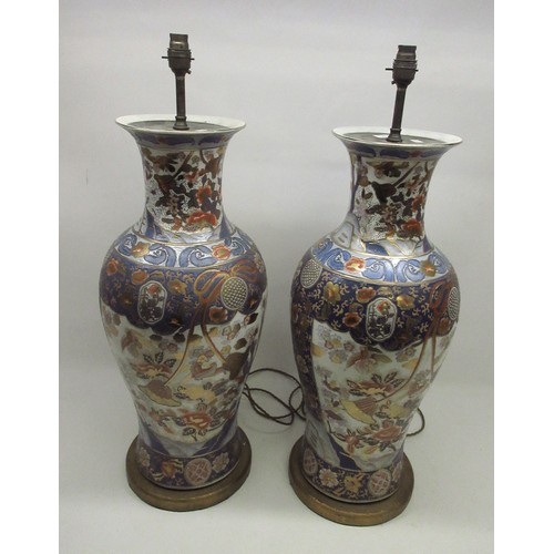 1240 - Pair of large table lamps, baluster bodies decorated in Imari style with exotic birds amidst trailin... 