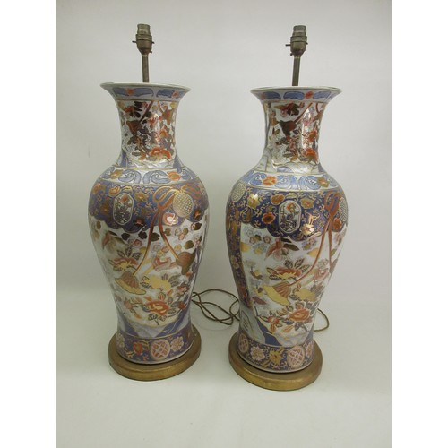 1240 - Pair of large table lamps, baluster bodies decorated in Imari style with exotic birds amidst trailin... 