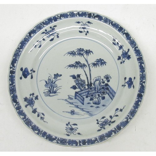 1172 - 18th century Chinese circular plate decorated to centre with a bamboo garden, in a floral and leaf r... 