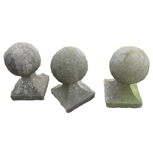 1707 - Set of three weathered composite stone spherical gatepost finials, on tapered square bases, W35cm D3... 