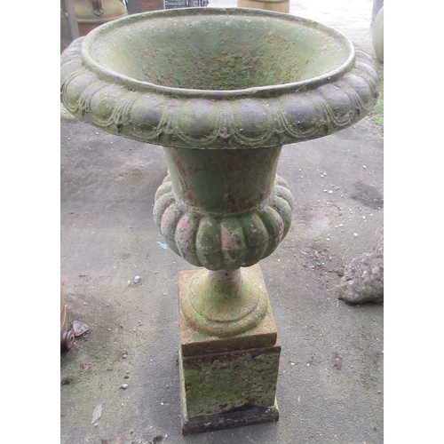 1691 - Small cast iron garden urn, part lobed body on socle support with square base and tapered square pli... 