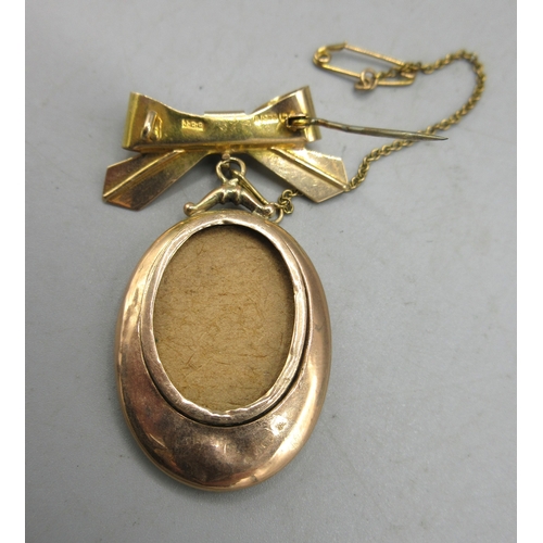 6 - 9ct yellow gold ribbon brooch, stamped 375, with drop pendant for photograph, 5.63g

Shipping £23.00... 