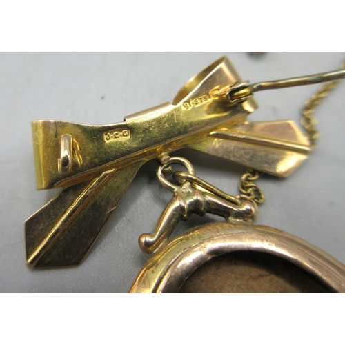 6 - 9ct yellow gold ribbon brooch, stamped 375, with drop pendant for photograph, 5.63g

Shipping £23.00... 