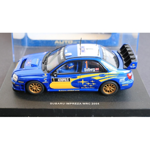 63 - Four 1/32 scale slot car models to include boxed Scalextric Club Ford Escort MKII 'Makinen-Liddon' N... 