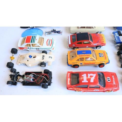 66 - Collection of previously run 1/32 scale slot car models from Scalextric and Polistil to include a bu... 