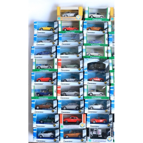 112 - Ninety seven boxed 1/43 scale diecast vehicle models from Cararama to include Lotus Europas, Mercede... 