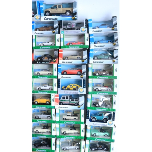 112 - Ninety seven boxed 1/43 scale diecast vehicle models from Cararama to include Lotus Europas, Mercede... 