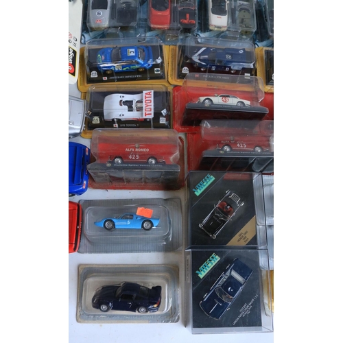 118 - Collection of diecast model sports cars and motorbikes, various scales and manufacturers to include ... 