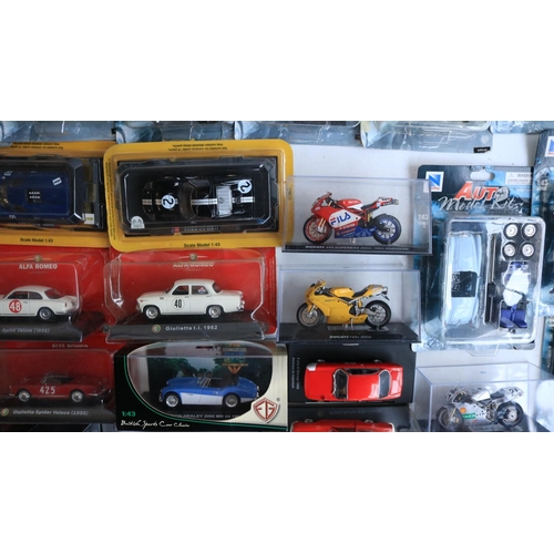 118 - Collection of diecast model sports cars and motorbikes, various scales and manufacturers to include ... 