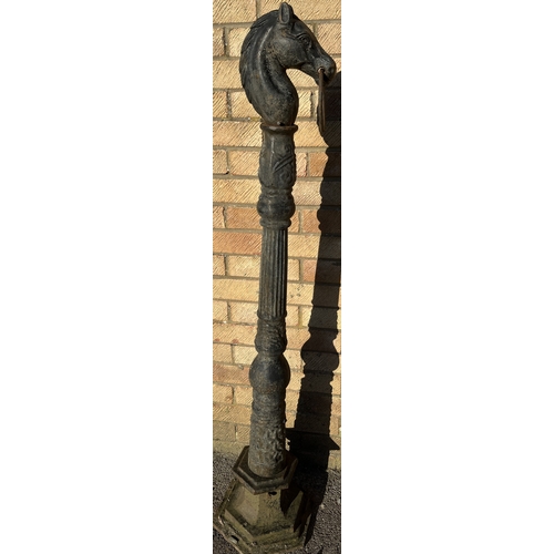 1708 - Cast iron hitching post, horse head and ring finial on fluted column and octagonal base, H134cm