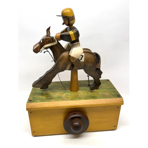 1254 - Hand made painted wooden automaton of a jockey riding a galloping horse, on rectangular base, signed... 