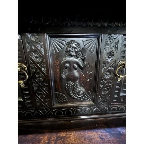 1557 - Large 17th century and later carved oak court cupboard, top with two lozenge carved doors and figura... 