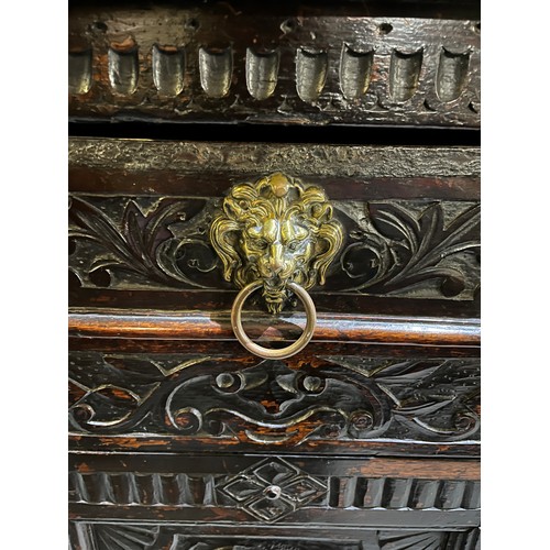 1557 - Large 17th century and later carved oak court cupboard, top with two lozenge carved doors and figura... 