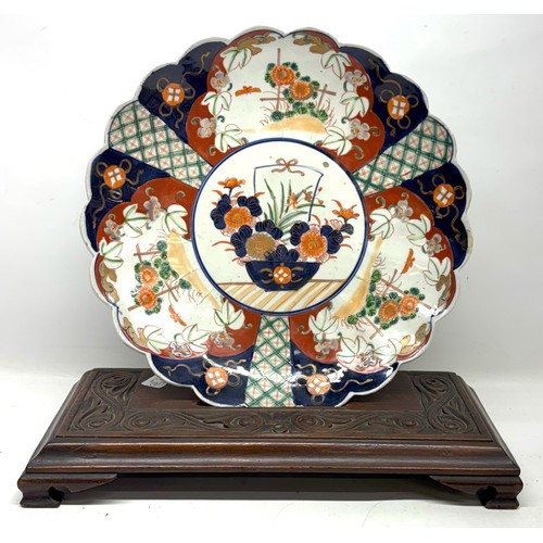 1157 - 20th century Japanese Imari circular waved edge dish, decorated with prunus around a central flower ... 