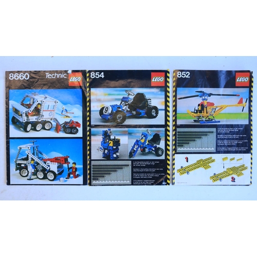 432 - Five vintage Lego Technics sets to include 852 helicopter, 854 racing cart, 8660 snow vehicle, 8845 ... 