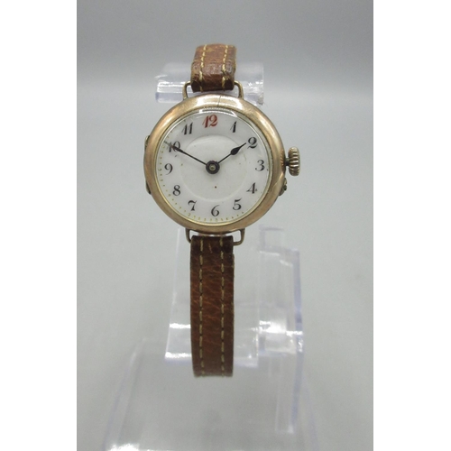 202 - Swiss ladies 9ct rose gold wristwatch on leather strap, stepped white porcelain Arabic dial with red... 