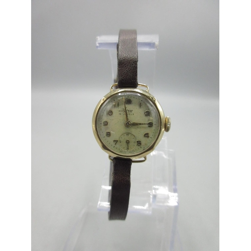 203 - Avia ladies 9ct gold wristwatch on leather strap, signed silvered Arabic dial with applied indices a... 