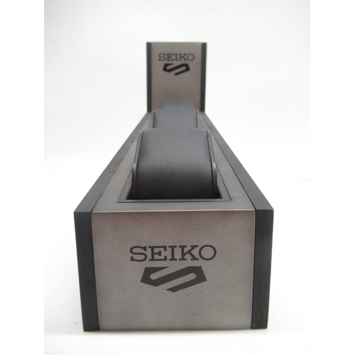 235 - Pair of Seiko 5 wristwatch shop display stands, holding three watches per display, L31cm

Shipping £... 