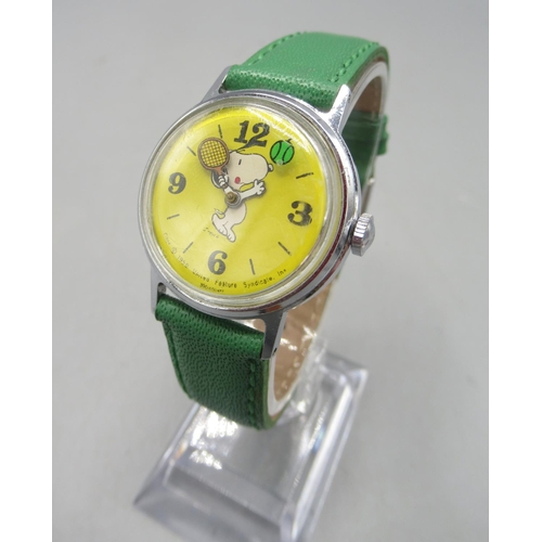 239 - Timex, Great Britain - 'Snoopy playing tennis' chrome wristwatch, yellow dial with Arabic and baton ... 