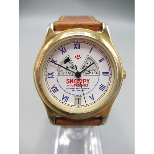 239 - Timex, Great Britain - 'Snoopy playing tennis' chrome wristwatch, yellow dial with Arabic and baton ... 