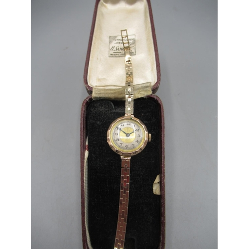 244 - Swiss lady's 9ct gold wristwatch on box link bracelet stamped .375, gold coloured dial with silvered... 