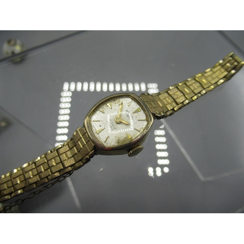 247 - Smiths De Luxe lady's gold plated wristwatch on gold plated expanding bracelet, signed silvered dial... 