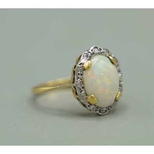 136 - 18ct yellow gold cluster ring set with large opal with diamond halo, stamped 18ct, size M1/2, 2.97g
... 