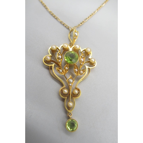 25 - Edwardian 15ct yellow gold drop pendant set with peridot and seed pearls, on 15ct yellow gold chain ... 