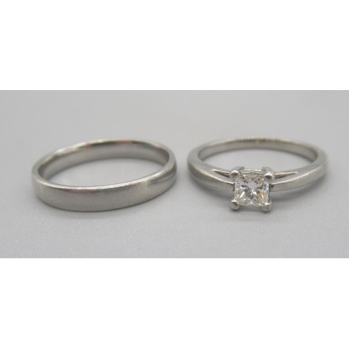 139 - Platinum engagement ring set with single square cut diamond, and a platinum wedding band, both stamp... 