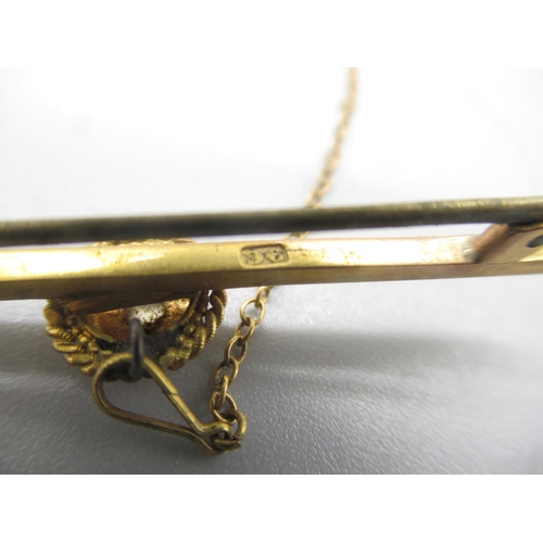 156 - 9ct yellow gold bar brooch set with single diamond in star setting, stamped 9c 3.84g

Shipping £23.0... 