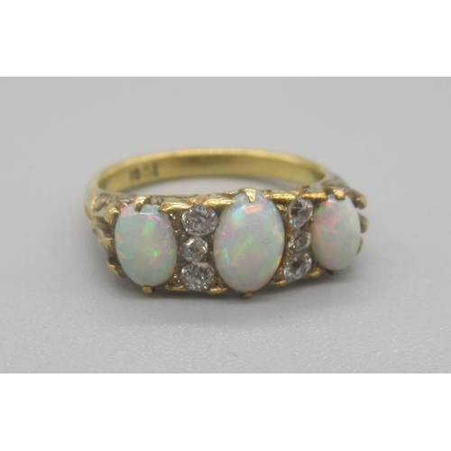 158 - 18ct yellow gold opal and diamond ring, the three cabochon opals separated by brilliant cut diamonds... 