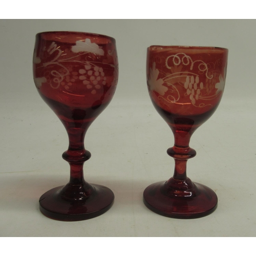 188 - Two 19th Century ruby tinted liqueur glasses, wheel cut decoration, H10cm and other later ruby tinte... 