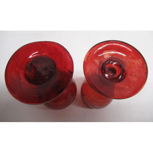 188 - Two 19th Century ruby tinted liqueur glasses, wheel cut decoration, H10cm and other later ruby tinte... 