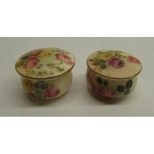 189 - Pair of Royal Worcester miniature lidded pots, blush ground decorated with floral sprays, one lid re... 