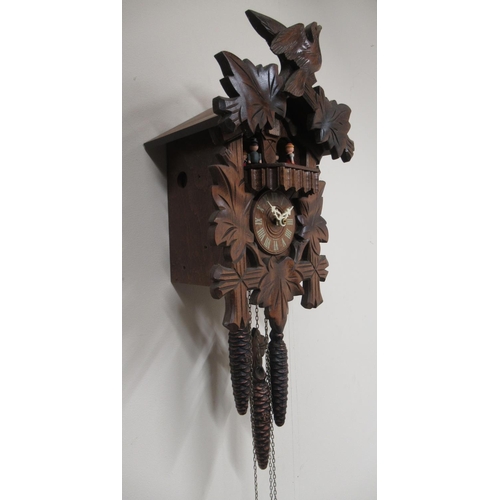 190 - 20th Century stained beech Black Forest musical wall clock, the case with carved decoration with bir... 