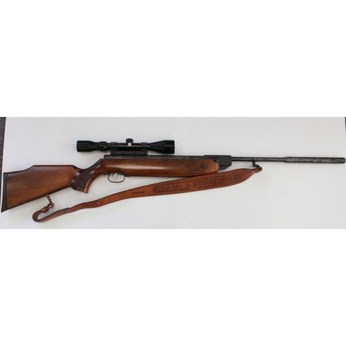 634 - Weihrauch HW 80 .22 break barrel air rifle. With Tasco scope, leather sling, gun slip, and a tin of ... 