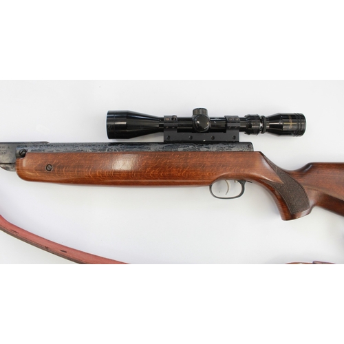 634 - Weihrauch HW 80 .22 break barrel air rifle. With Tasco scope, leather sling, gun slip, and a tin of ... 