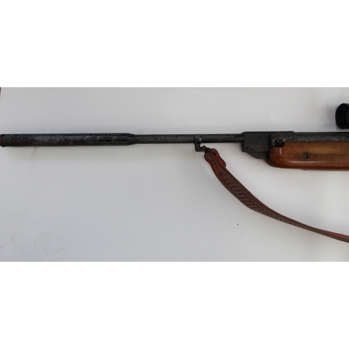 634 - Weihrauch HW 80 .22 break barrel air rifle. With Tasco scope, leather sling, gun slip, and a tin of ... 