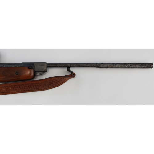 634 - Weihrauch HW 80 .22 break barrel air rifle. With Tasco scope, leather sling, gun slip, and a tin of ... 