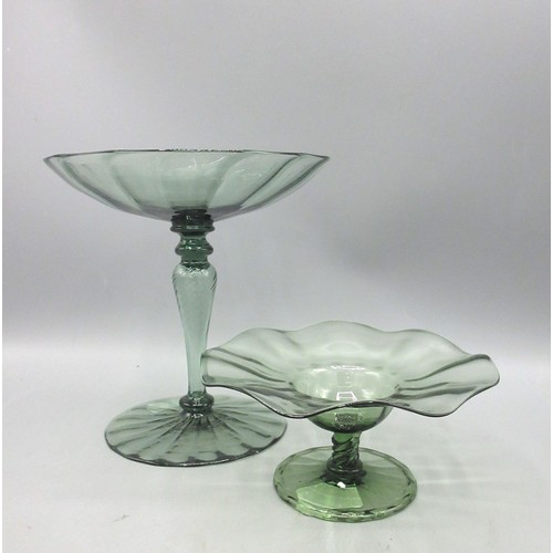 Whitefriars, James Powell & Sons green tazza with writhen stem, from the Roman Range by Harry Powell circa 1870, H15.5cm and another James Powell & Sons tazza, H6cm