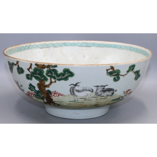 1340 - Chinese porcelain famille rose bowl, enamel decoration with two goats and a fir tree in a fenced gar...