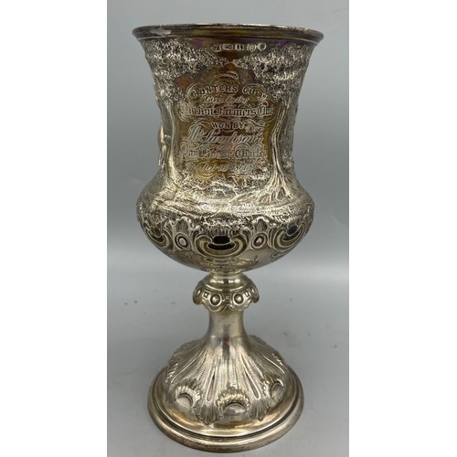 Victorian silver presentation cup 'Hunters cup, given by the Norton Farmers Club, won by, M Sampson's... Oct 16th 1861' repousse country scene with hurdling horses, stood on round  pedestal foot by Martin Hall & Co, Sheffield 1861, 6.5ozt H17.5cm