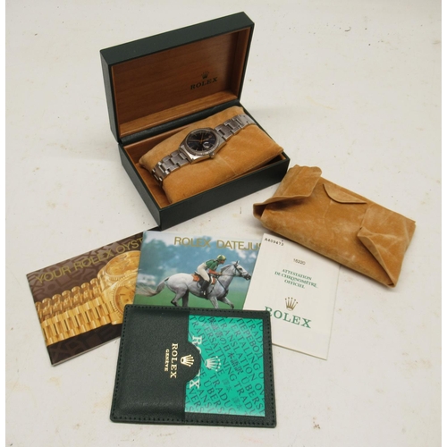 Rolex Oyster Perpetual Datejust stainless steel automatic wristwatch on matching Oyster bracelet no. 78360, end links no. 558B with deployment clasp, signed blue sunburst dial with baton indices and centre seconds, screw on case back, Rolex ref. 16220, serial no. A409473, D36.1mm