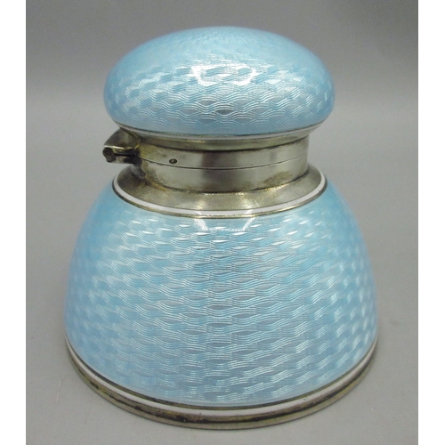 Early 20th century silver and baby blue guilloche enamel inkwell, domed form with basketweave-like engine turned pattern and hinged lid, stamped 935, H6.5cm D7.5cm

Shipping £28.00 plus vat (UK Only)