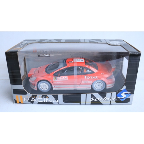 Three weathered 1/18 scale diecast rally car models from Solido