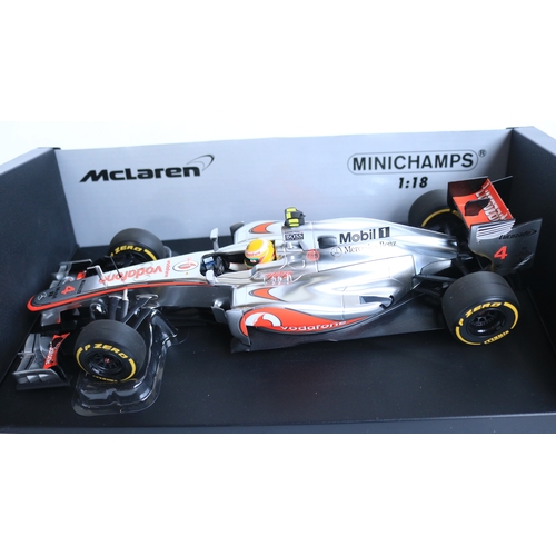 Two 1/18 scale diecast 2012 F1 season Vodafone McLaren Mercedes