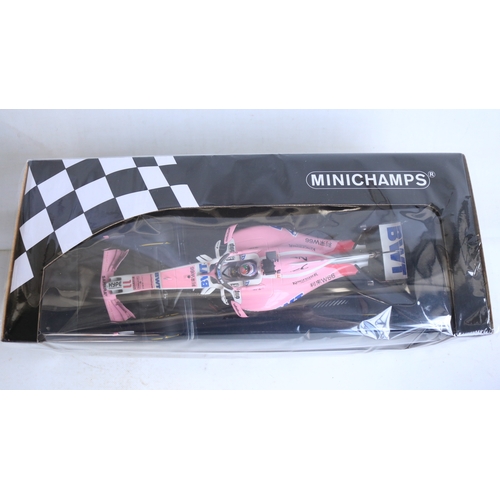 145 - Two 1/18 scale diecast 2018 racing season Force India Mercedes VJM11 racing car models to include 11... 