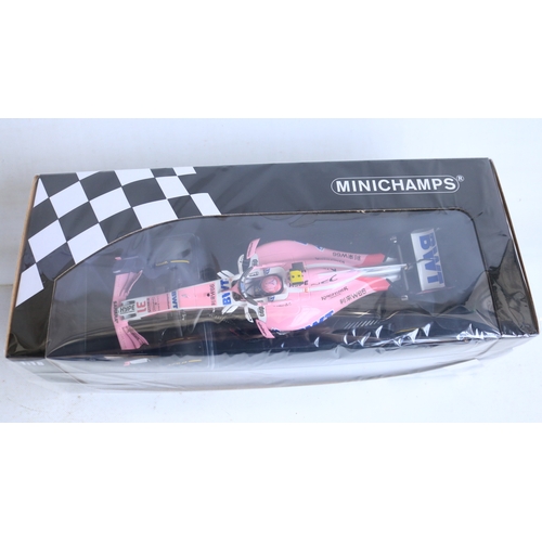 145 - Two 1/18 scale diecast 2018 racing season Force India Mercedes VJM11 racing car models to include 11... 
