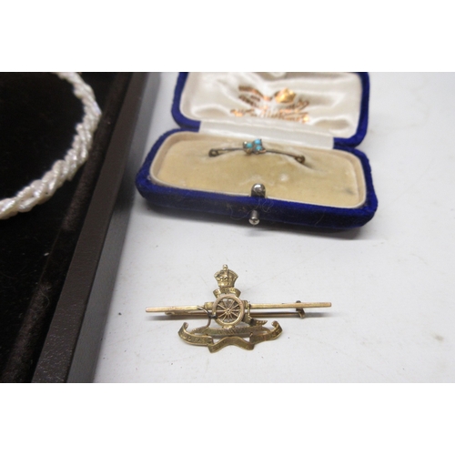 43 - Yellow metal Royal Artillery bar brooch, a vintage yellow metal bar brooch set with turquoise, two y... 