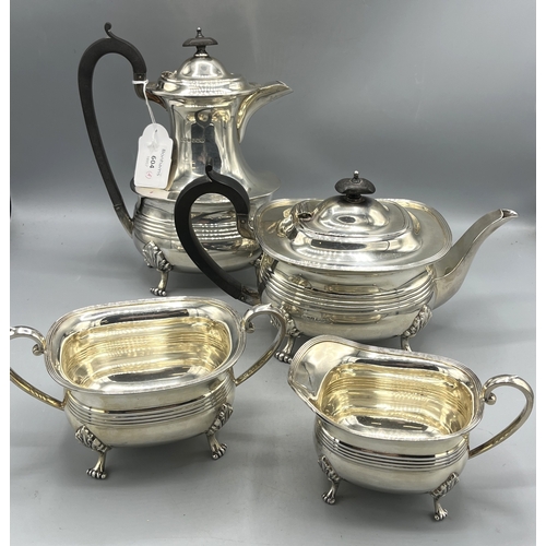 650 - 20th century silver four piece tea service to include teapot, hot water jug, sugar bowl and milk jug...